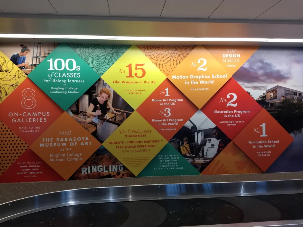 Wall mural displays diamond-shaped panels highlighting achievements and offerings of Ringling College of Art and Design, including top rankings and on-campus galleries.